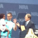 Elaih Wagan's father holds her at the NRA convention. (Twitter)